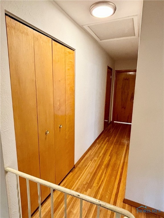 corridor featuring wood-type flooring