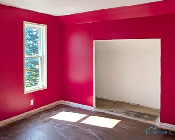 empty room featuring hardwood / wood-style flooring