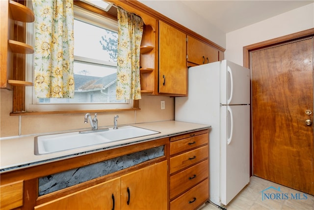 kitchen with white refrigerator and sink