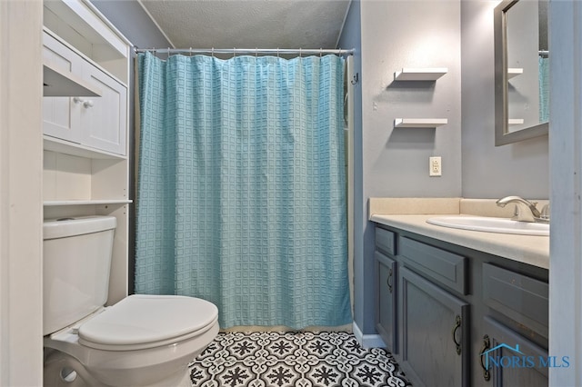 bathroom featuring toilet, a shower with curtain, tile patterned floors, vanity, and a textured ceiling