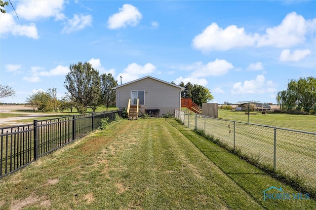 view of yard with a rural view