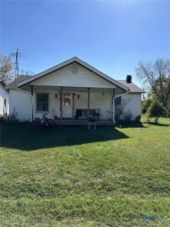 view of front of house featuring a front yard and a porch