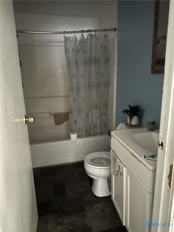 full bathroom featuring vanity, shower / bath combo with shower curtain, and toilet