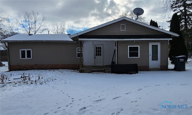 view of snow covered house