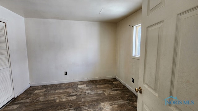 spare room featuring dark hardwood / wood-style floors