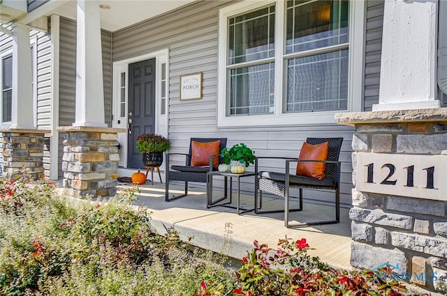 doorway to property with covered porch