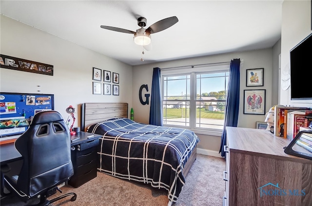 carpeted bedroom featuring ceiling fan