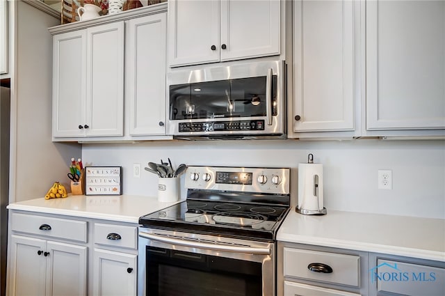 kitchen featuring white cabinets and stainless steel appliances