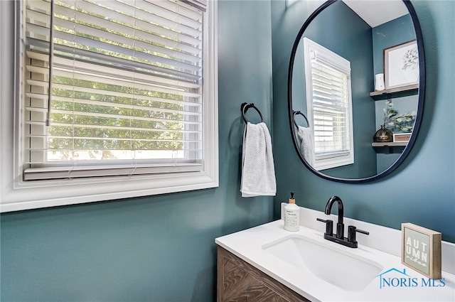 bathroom featuring plenty of natural light and vanity