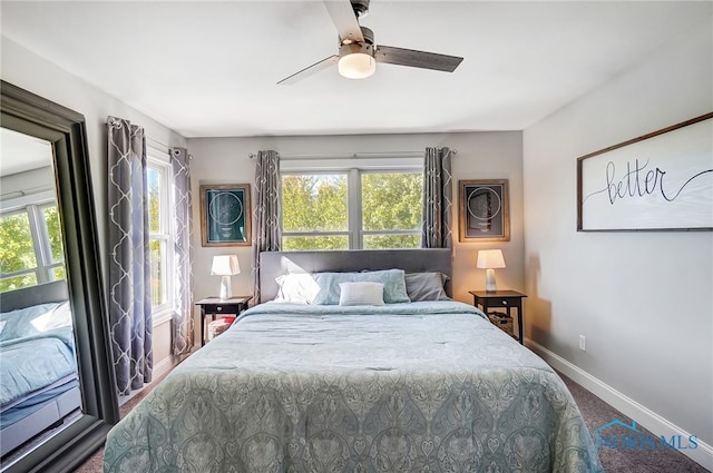 bedroom with carpet floors, multiple windows, and ceiling fan