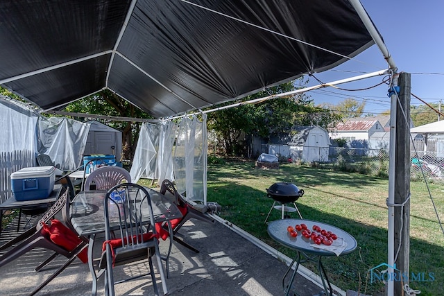 view of patio / terrace with a storage shed