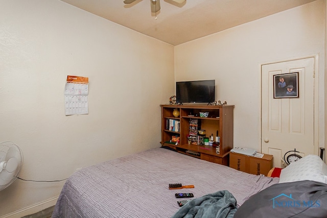 bedroom featuring lofted ceiling and ceiling fan