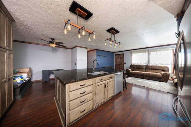 kitchen with dark hardwood / wood-style floors and a textured ceiling