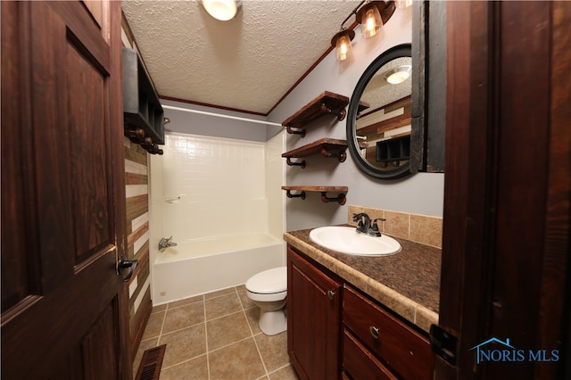 full bathroom with tile patterned flooring, toilet, shower / bathing tub combination, vanity, and a textured ceiling