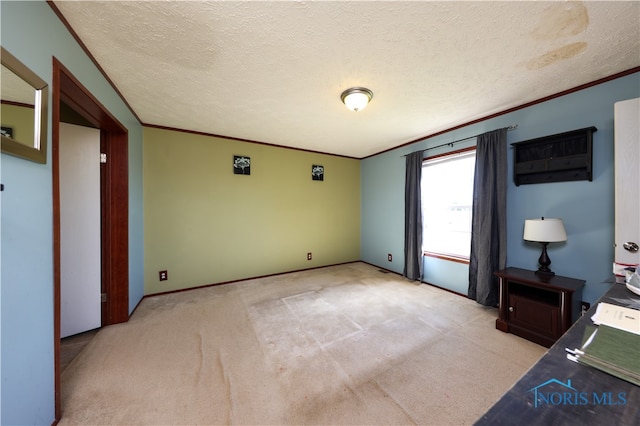 interior space featuring light colored carpet, a textured ceiling, and ornamental molding