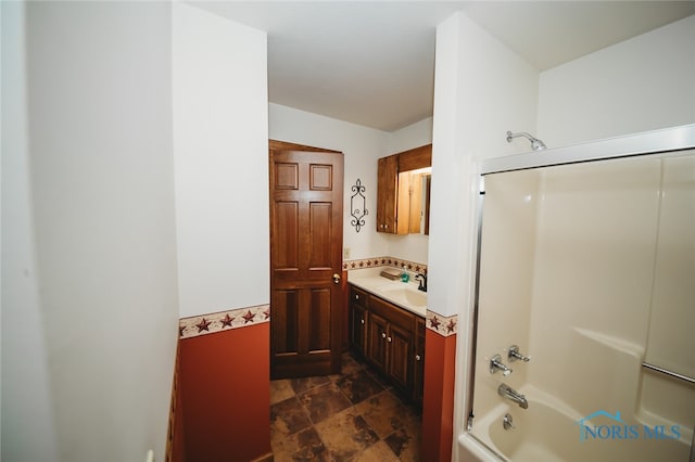 bathroom with shower / bathing tub combination and vanity