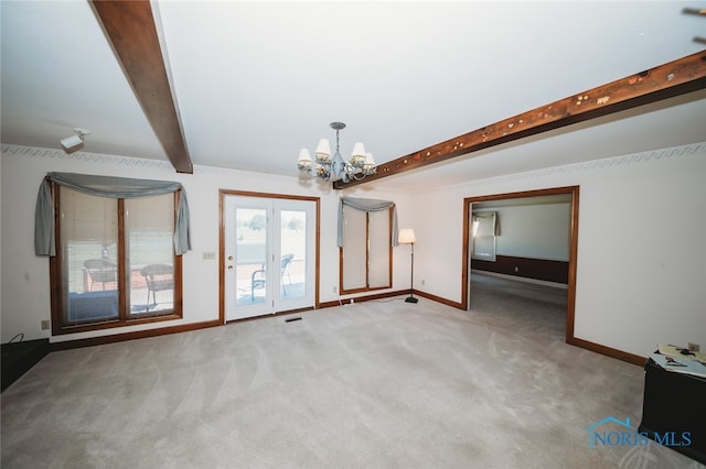 interior space with carpet floors, beam ceiling, and a chandelier