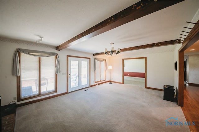 unfurnished living room featuring wood-type flooring, beam ceiling, and an inviting chandelier