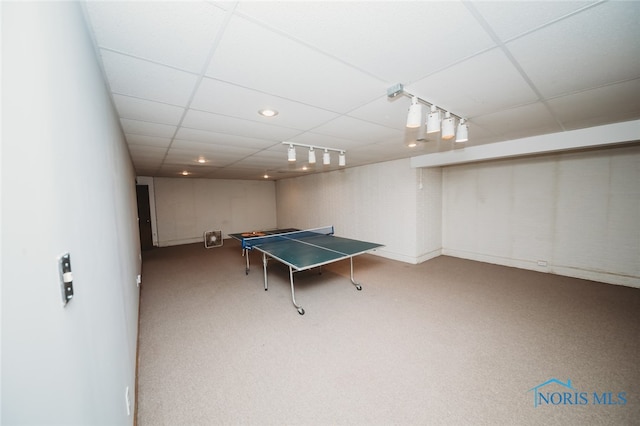 game room with carpet, a drop ceiling, and track lighting