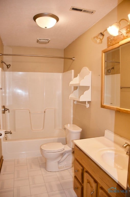 full bathroom with vanity, toilet, and  shower combination