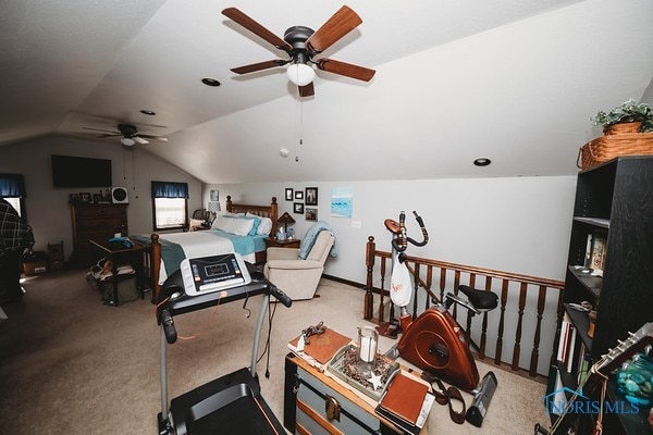 workout room with carpet and vaulted ceiling