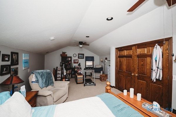 bedroom featuring lofted ceiling, carpet flooring, and ceiling fan