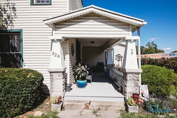 doorway to property with a porch