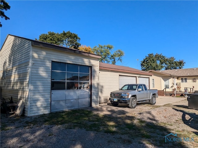 view of side of home featuring a garage