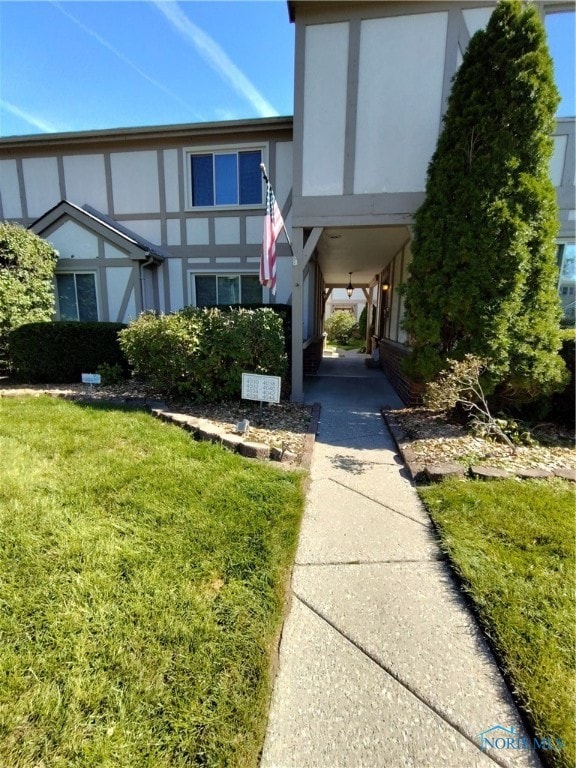 exterior space with a front yard