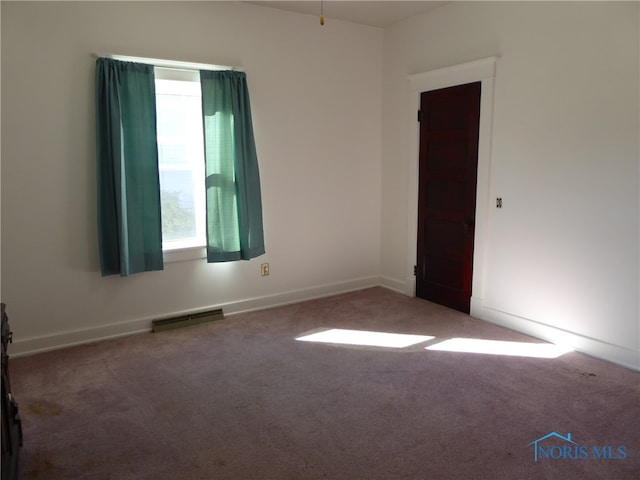 spare room with carpet flooring