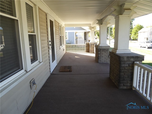 view of patio featuring a porch