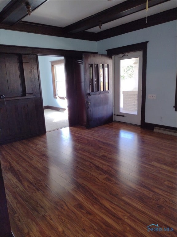 interior space featuring dark hardwood / wood-style floors and beam ceiling