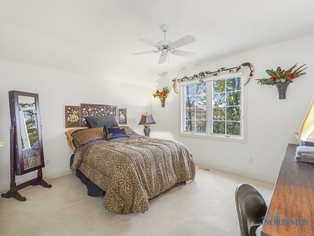 bedroom featuring vaulted ceiling, carpet floors, and ceiling fan