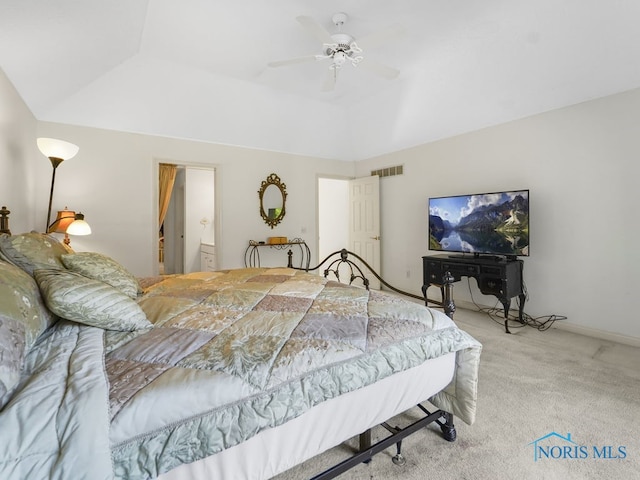 carpeted bedroom with ensuite bathroom and ceiling fan