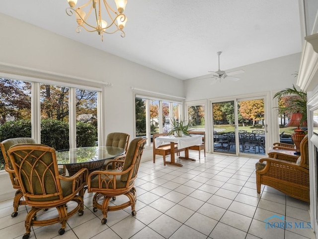 sunroom with ceiling fan with notable chandelier