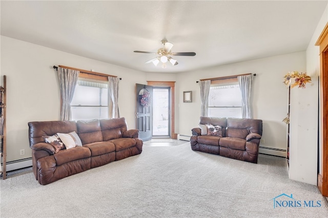 living room featuring ceiling fan, a baseboard radiator, plenty of natural light, and light colored carpet