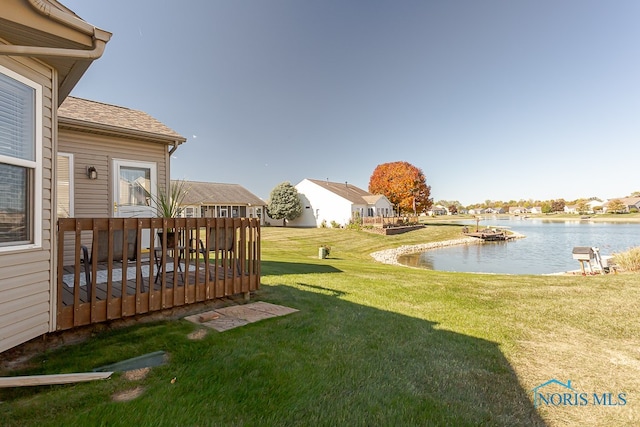 view of yard featuring a deck with water view