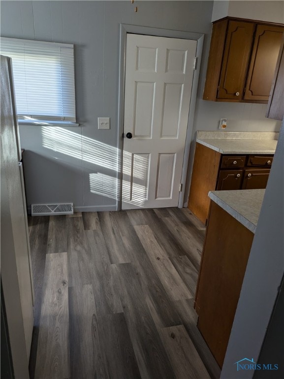 kitchen with dark hardwood / wood-style floors