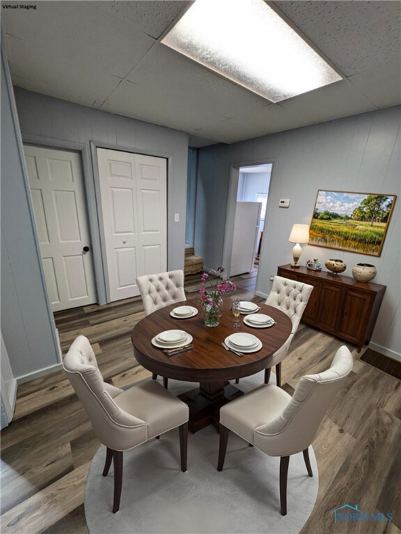 dining area featuring hardwood / wood-style flooring