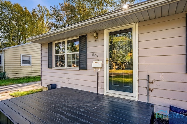 entrance to property with a deck