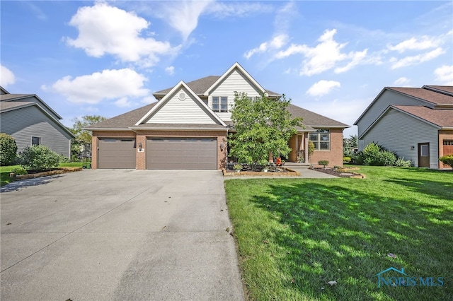 view of front facade featuring a front yard and a garage