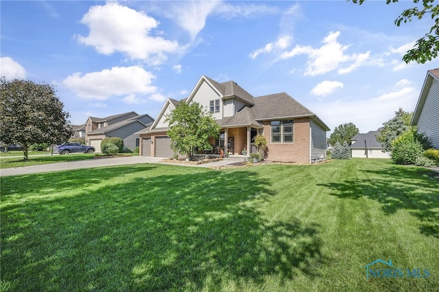 view of front of house with a garage and a front lawn