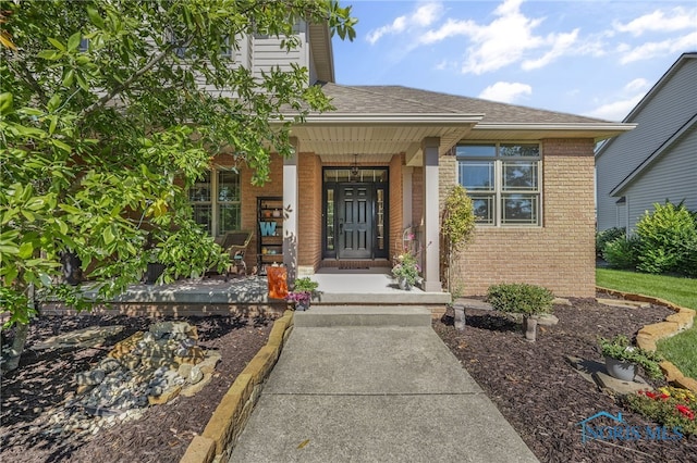 doorway to property featuring a porch