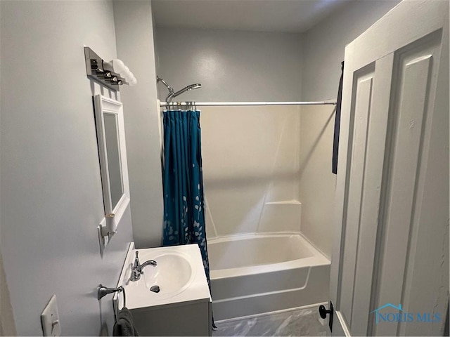 bathroom with vanity and shower / bath combo