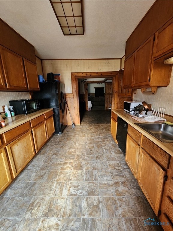 kitchen featuring sink and black appliances