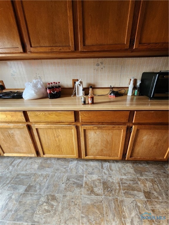 kitchen featuring tasteful backsplash