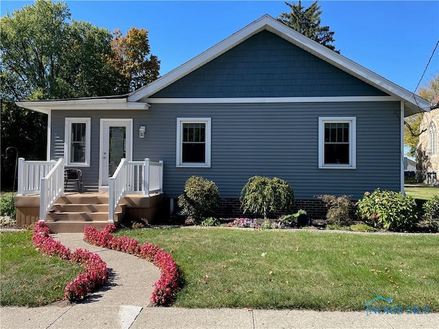 view of front of home with a front yard