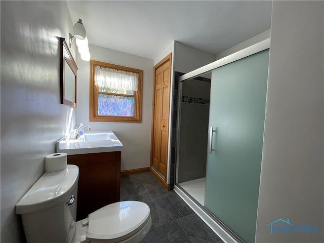 bathroom featuring an enclosed shower, vanity, tile patterned flooring, and toilet