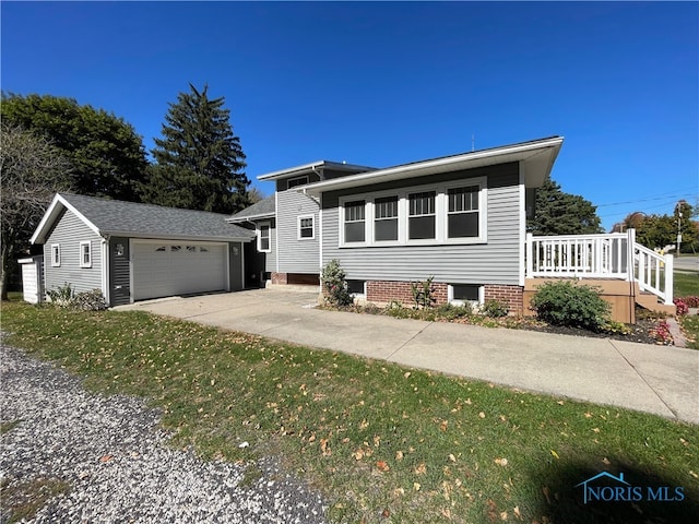 view of front of property with an outdoor structure and a garage