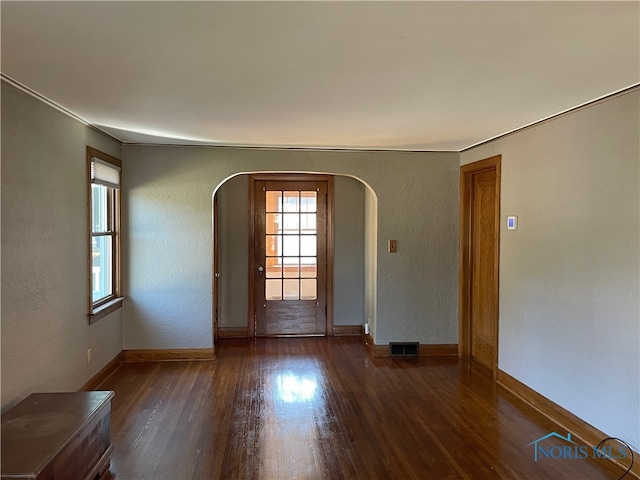 spare room with dark hardwood / wood-style floors